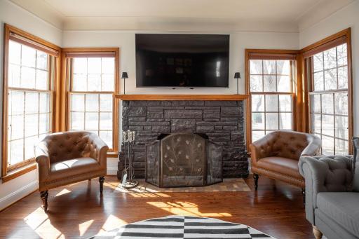 Wood burning fireplace with lake views beyond