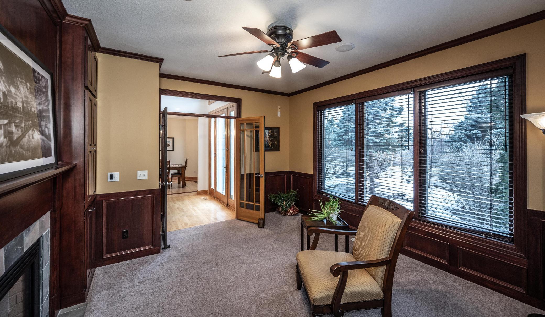 Glass French doors can close off the office/den for privacy, plus you will love the very large windows overlooking the front yard.