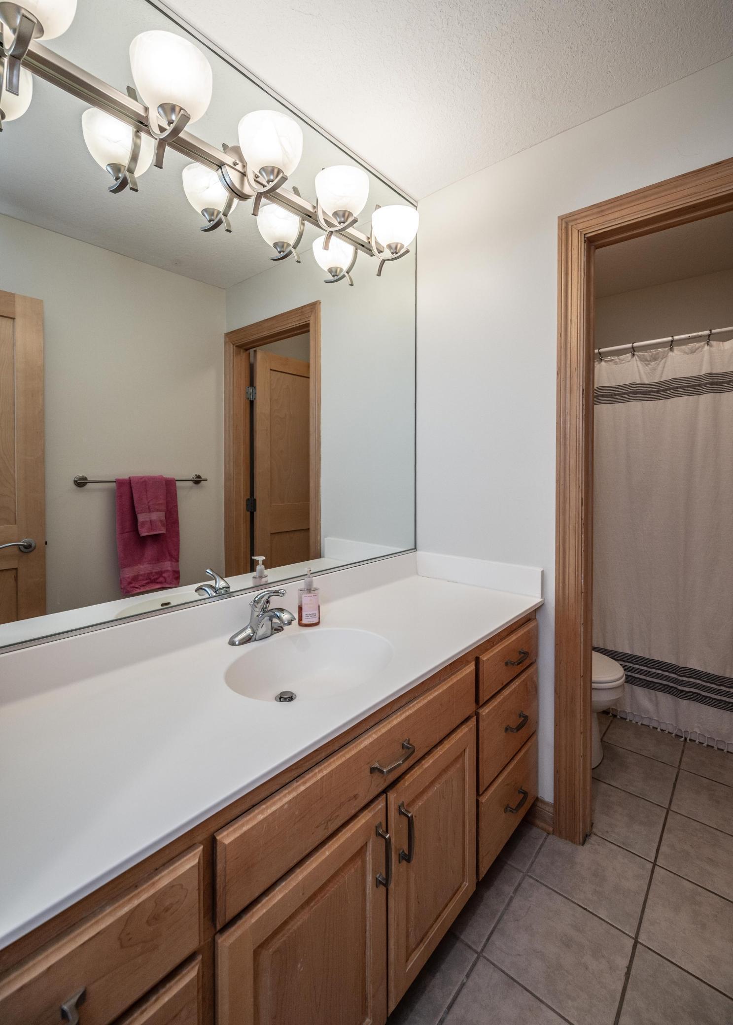 Full bath has separate shower and toilet room for ease of getting ready.