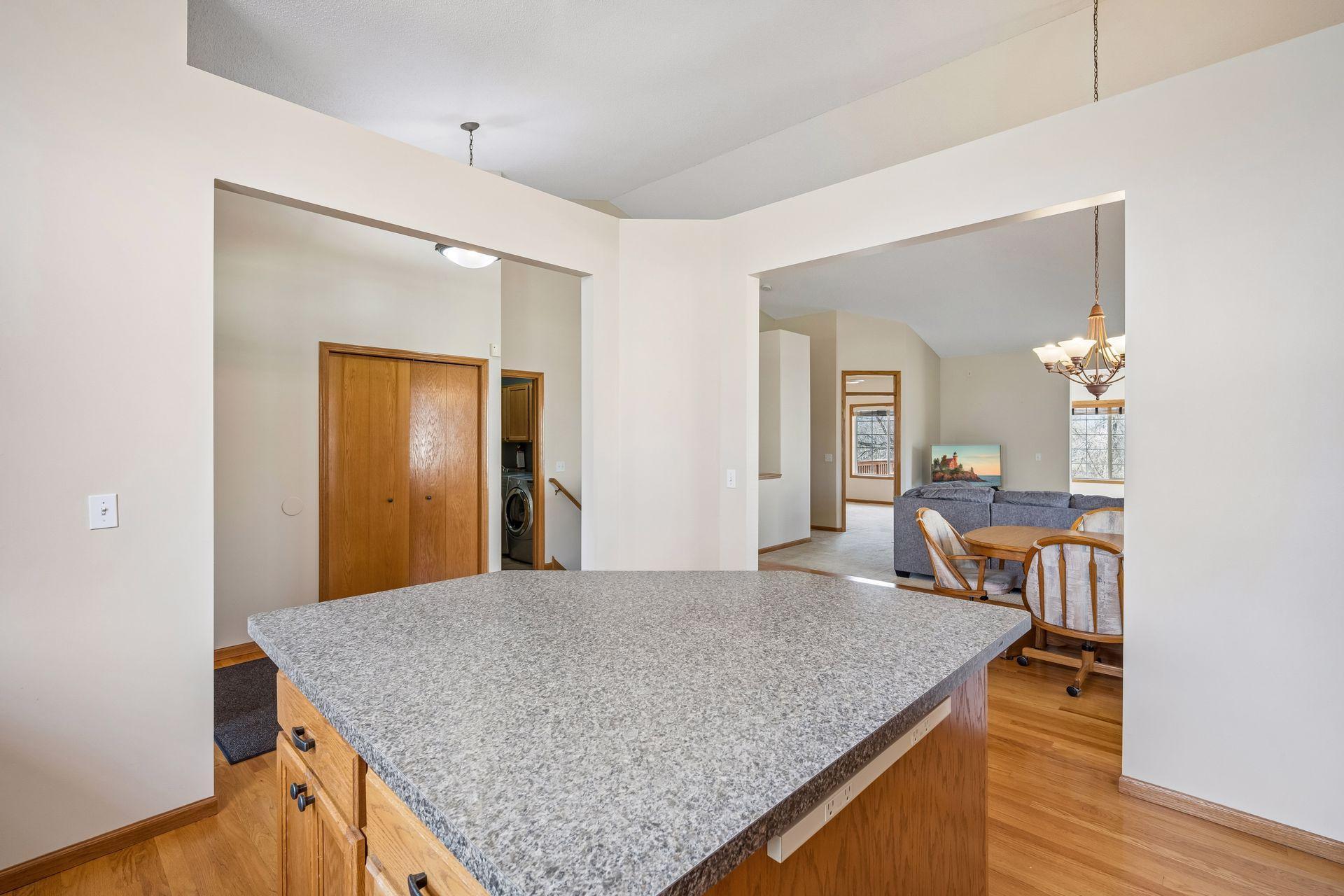View from the Kitchen to Dining, Laundry, Bedroom and Living Room.