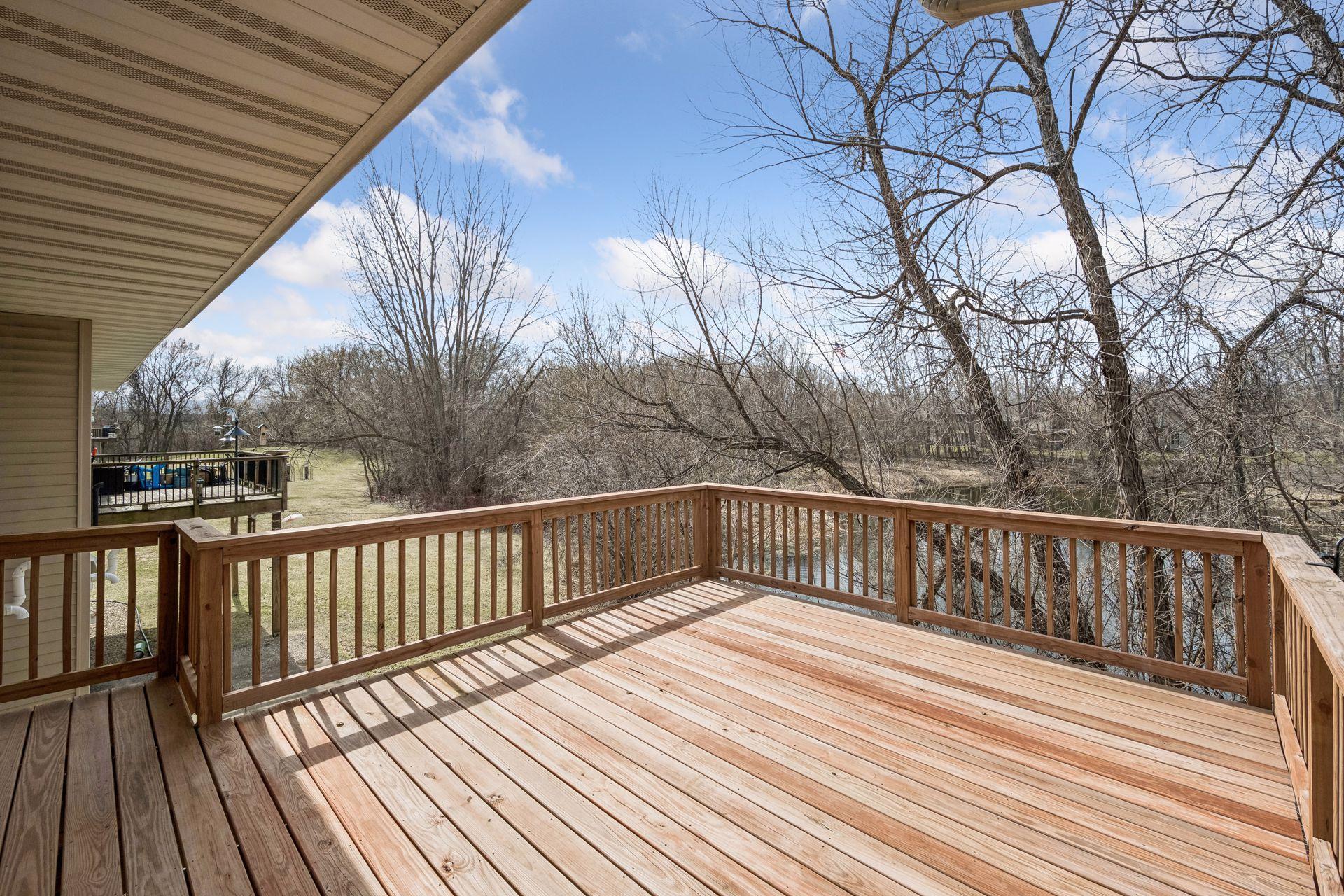 Large deck overlooking pond and wildlife.