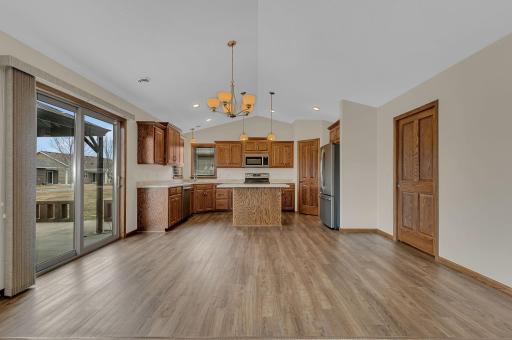 Dining Room walks out to concrete patio with Pergola