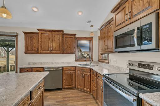 Corner kitchen sink with double windows to maximize natural light