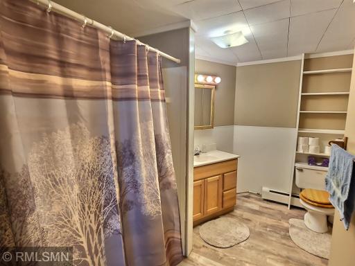 The lower-level bathroom provides LVP flooring, tub/shower combo, and a great amount of space.