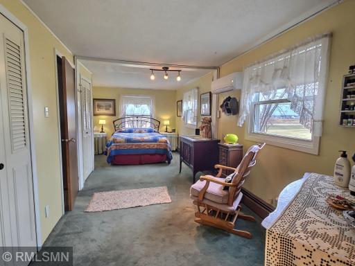 The primary suite! Incredibly spacious in size, this primary bedroom measures a whopping 23' x 10' and offers a sizable walk-in closet as well.