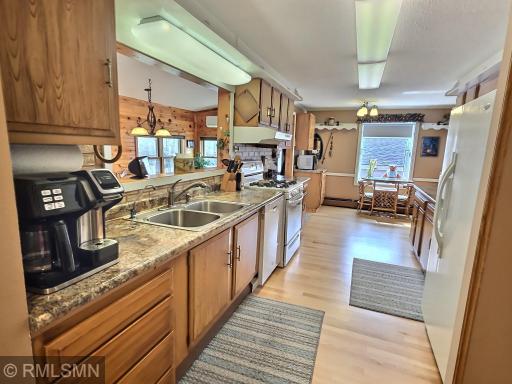 The light and bright galley kitchen creates a highly functional space to prep while keeping eyes on other spaces on the main level.