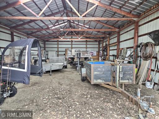 The second outbuilding is also 45'x30' and includes plenty of cold storage space. Access the first outbuilding through the back area of this shed. A sand point well is also located in this outbuilding, ideal for watering.