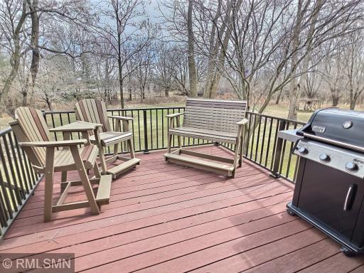The maintenance-free backside deck is the ideal space for outside dining, entertaining, and relaxing, all while enjoying the private views.