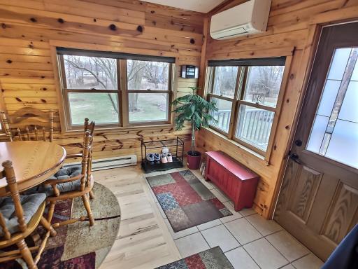 From the side deck, the stunning glass door ushers you in to a tile pad that merges into hickory floors seamlessly. A spacious space to kick off the shoes and enter in.