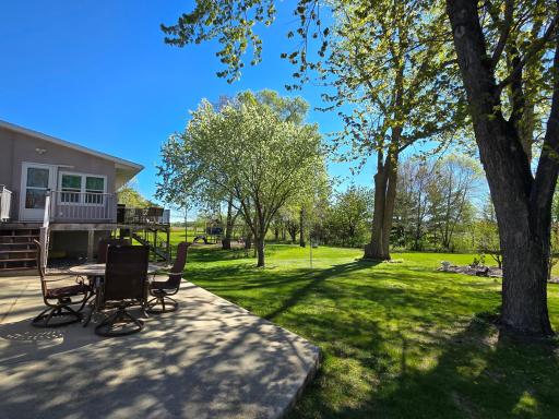 The backside concrete slab is ideal for that dining set. A wonderful, private setting awaits!