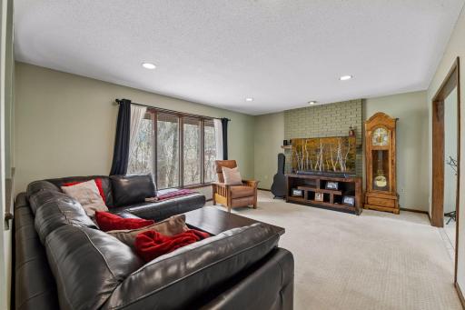 Main floor living room with wood burning fireplace
