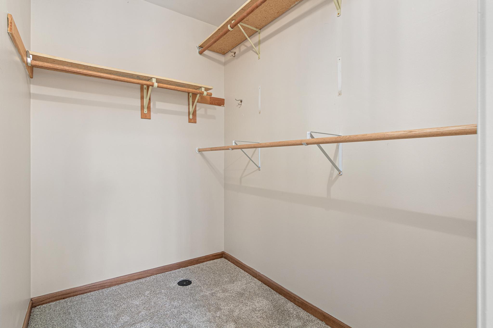 Primary bedroom walk-in closet.