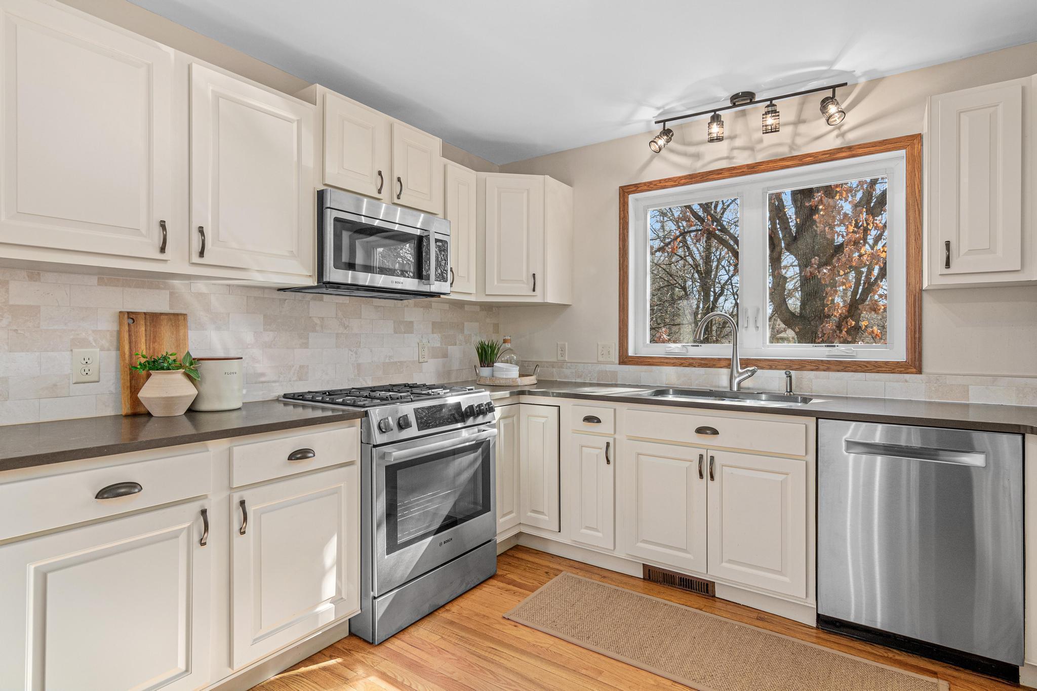 Tons of counter and cabinet space in this very workable kitchen.