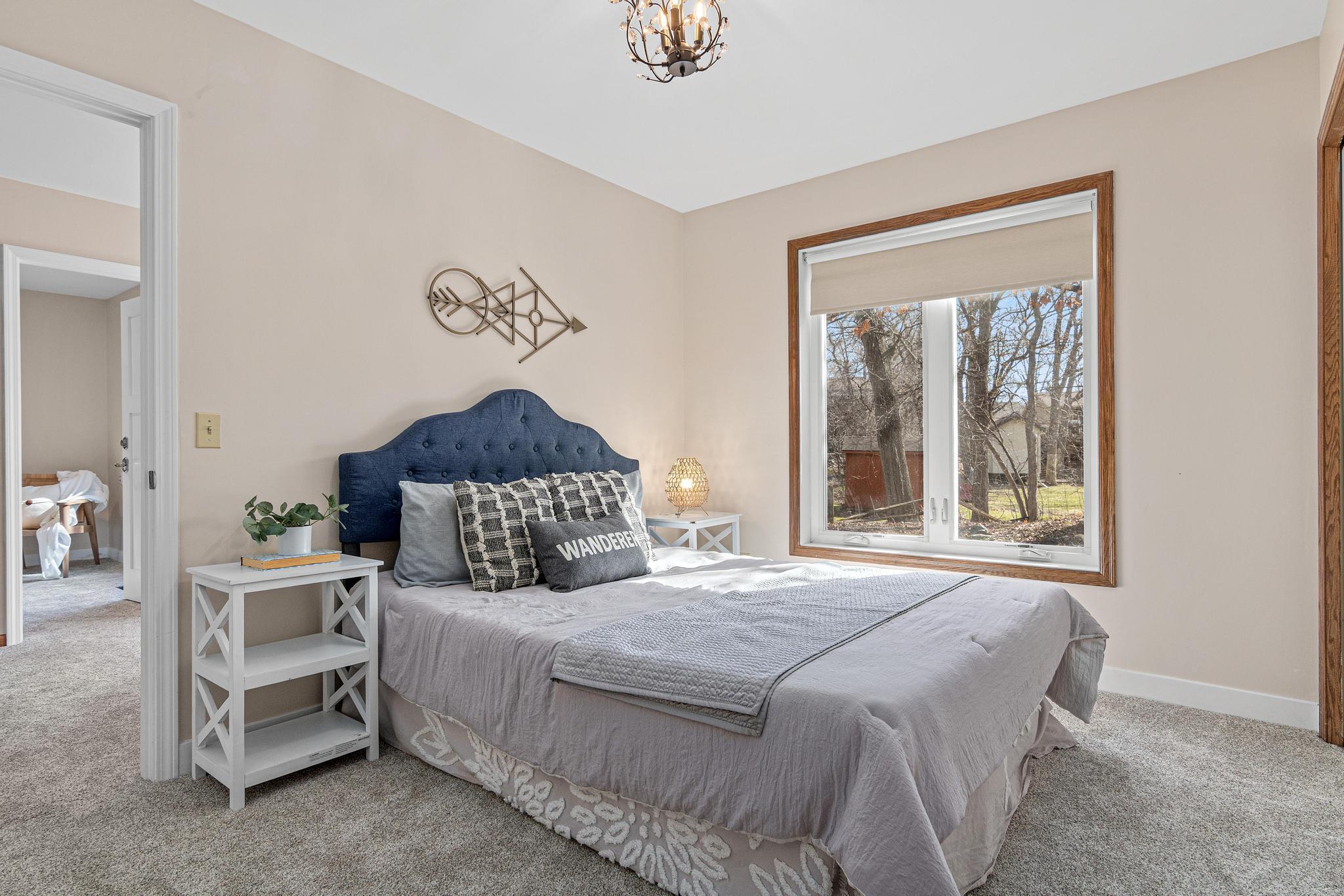 The second bedroom has plenty of room for a queen-sized bed, night stands, dressers, and more. Again, large windows in the lower level provide plenty of sunlight.