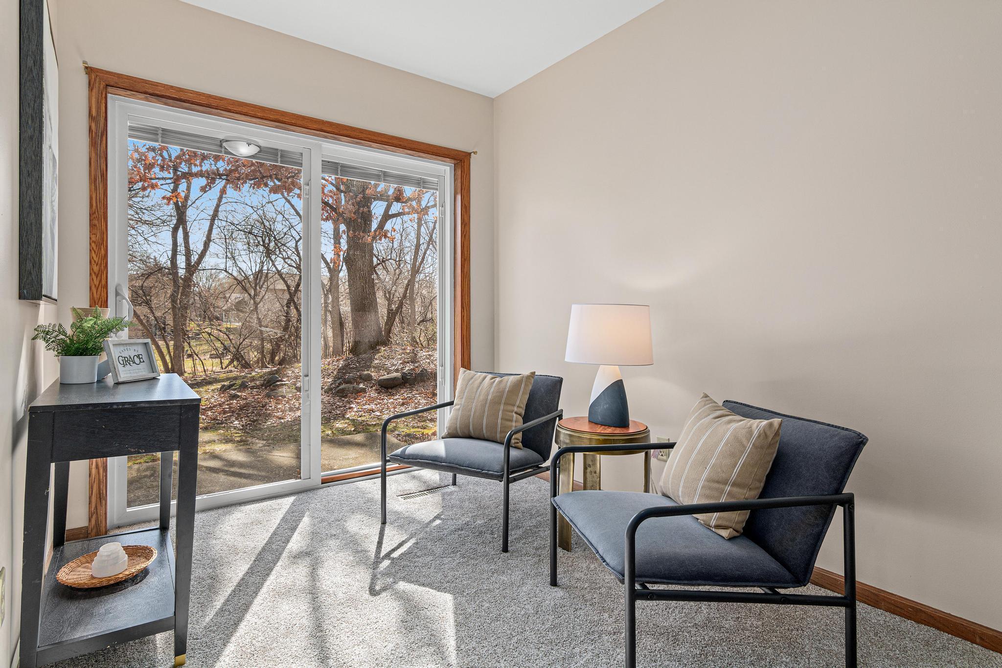 Lower level flex space / family room. Walk out to the lower level patio and backyard. The carpet has been updated throughout the lower level.