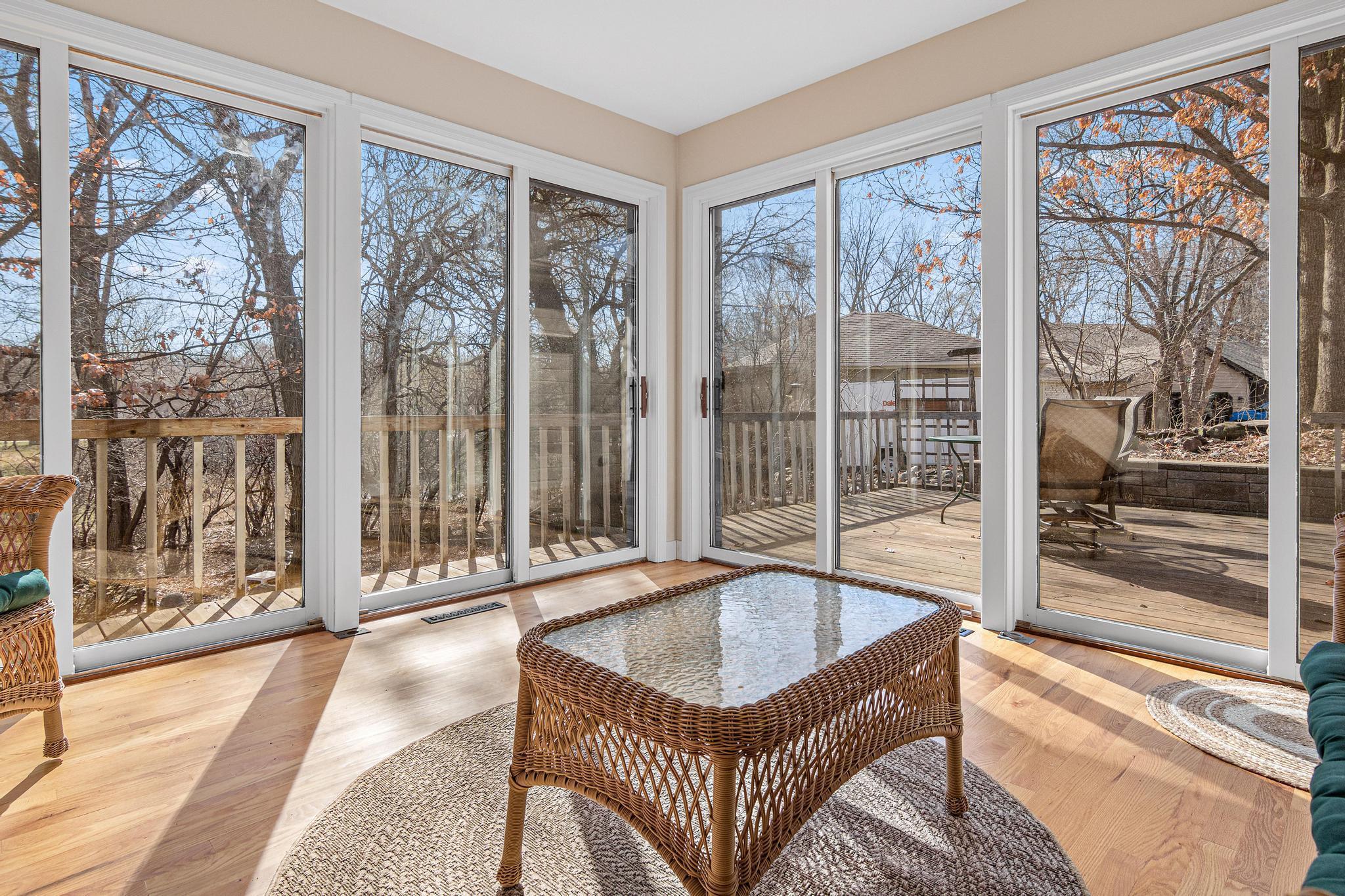 This sunroom is what dreams are made of! Four functional sliding doors allow for expansive views of the gorgeous backyard setting. Walkout onto the large deck or relax in this amazing space!