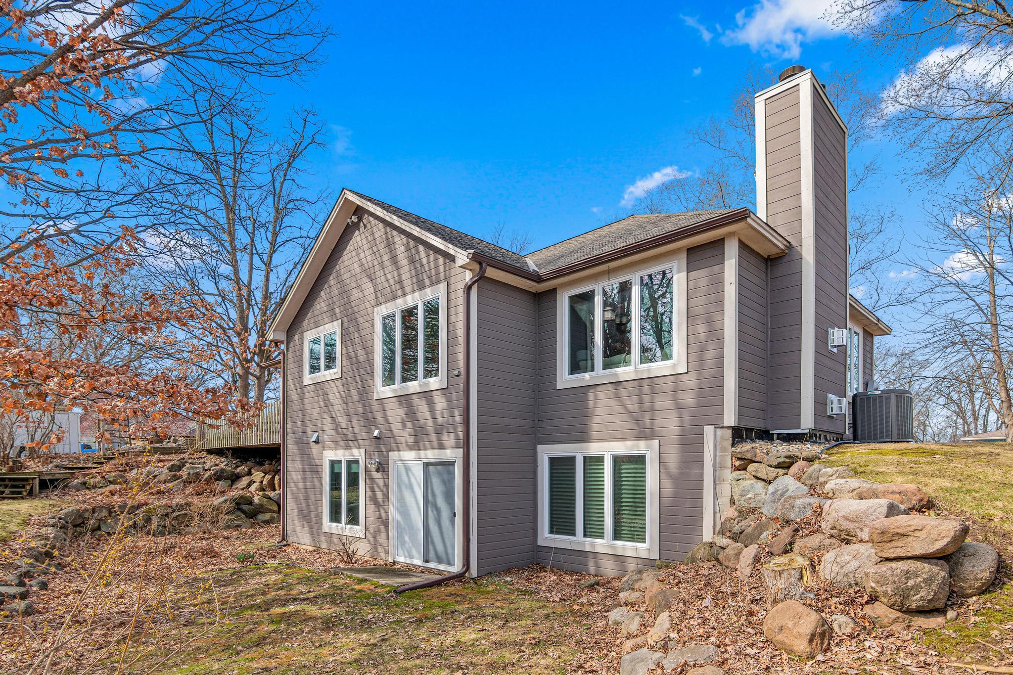 Beautiful rock retaining walls blend into the landscaping and create a gorgeous backyard oasis.
