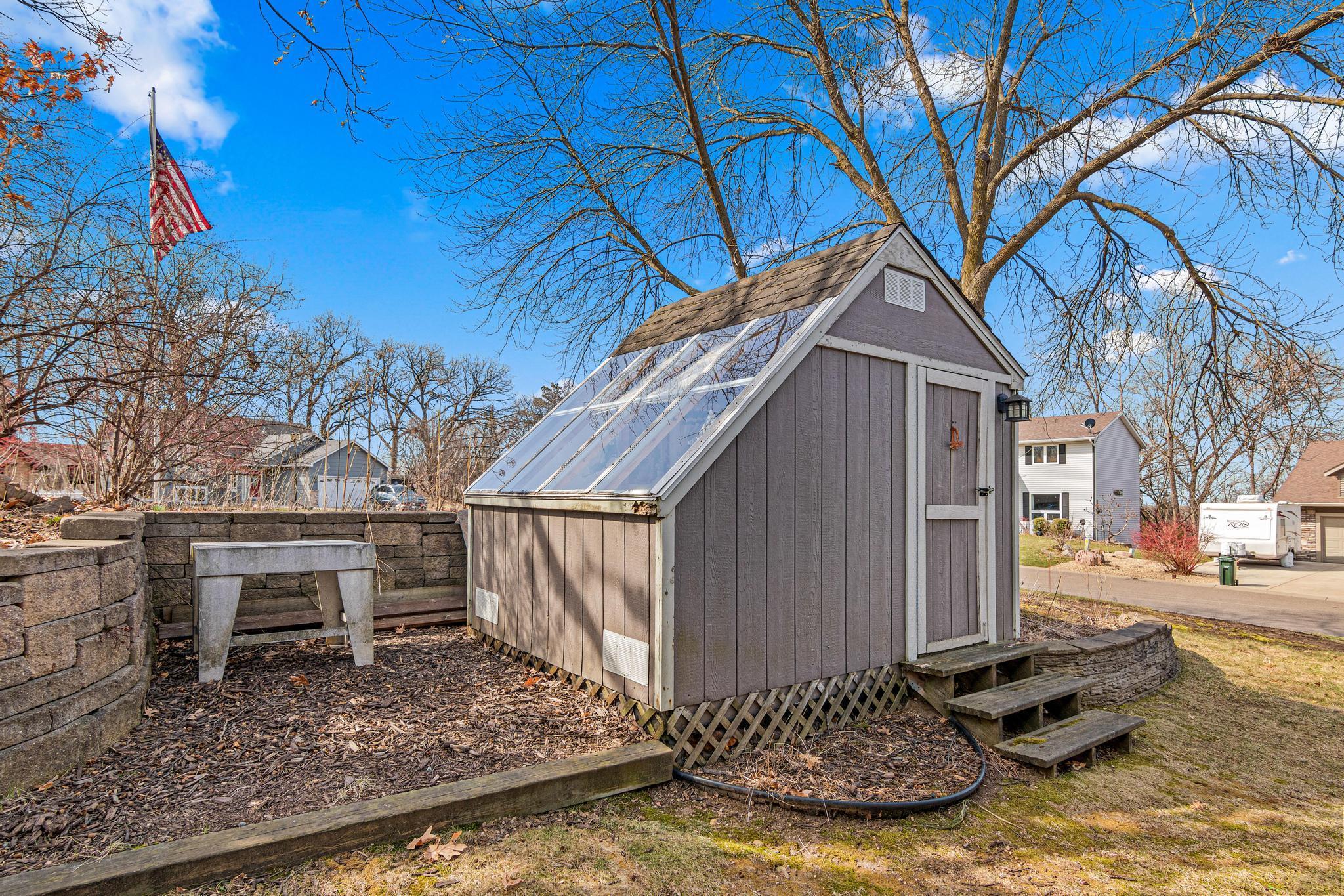 The included shed is a gardener's dream! Or, make it into a "she-shed" or "man cave".