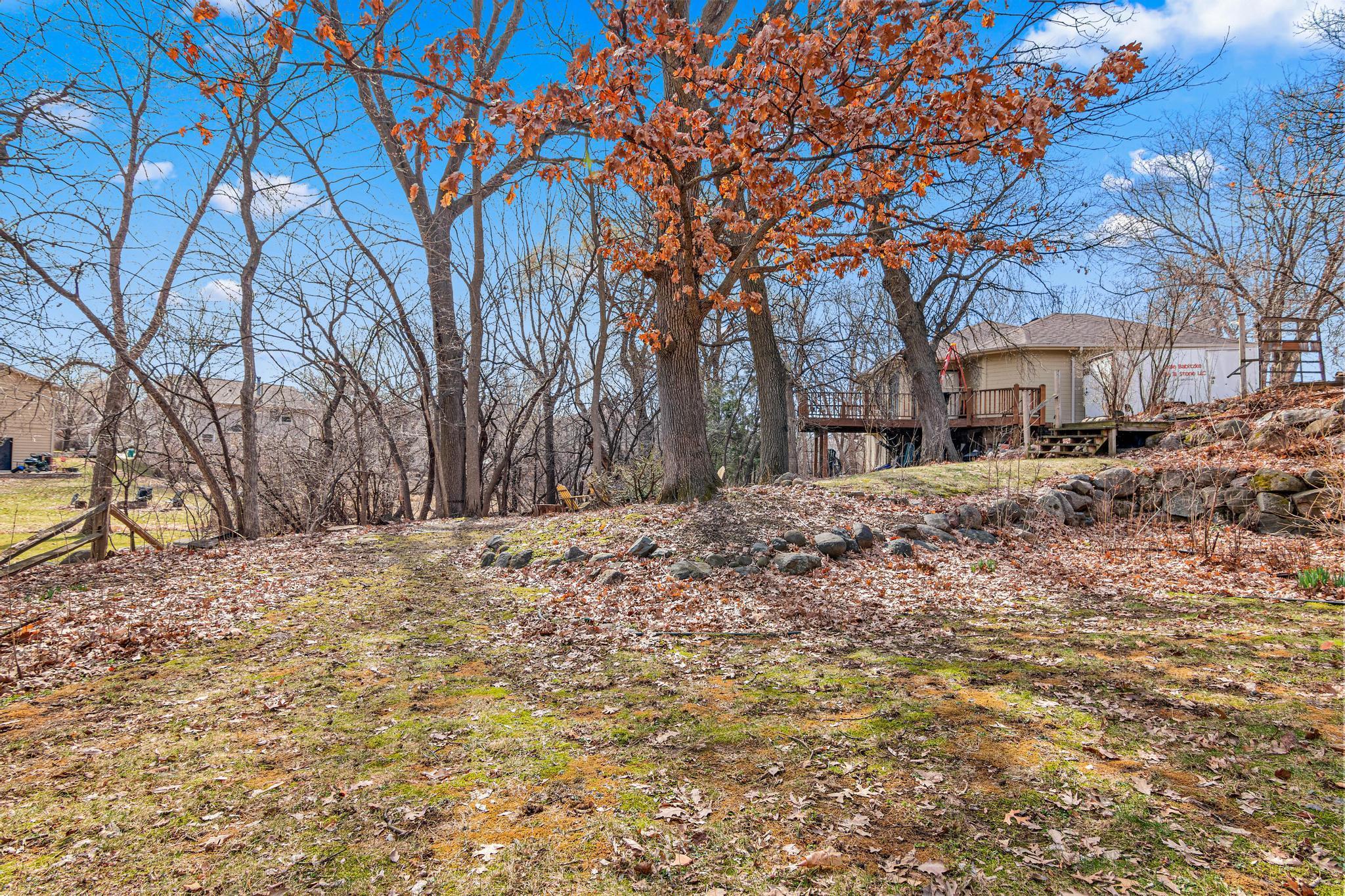 The backyard is quiet and peaceful. It includes mature trees and beautiful landscaping that has been professionally maintained.