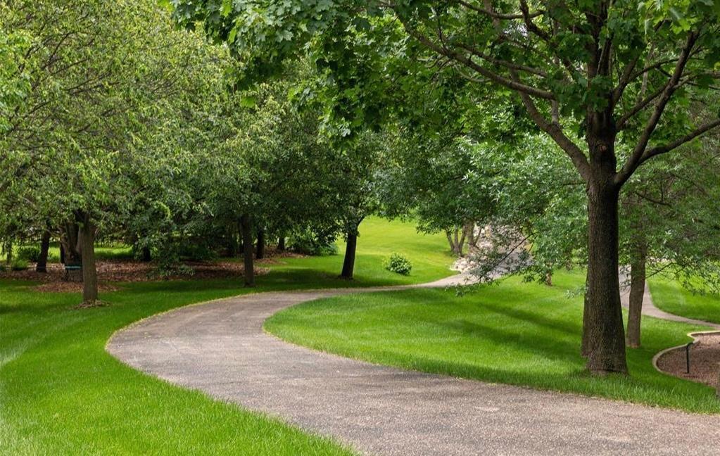 Winding walking trails with peaceful benches woven throughout Stonemill Farms