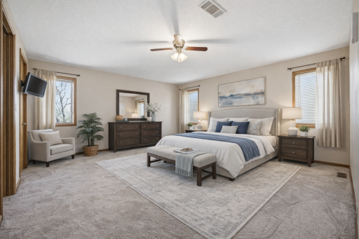 Primary main floor bedroom *Digitally staged