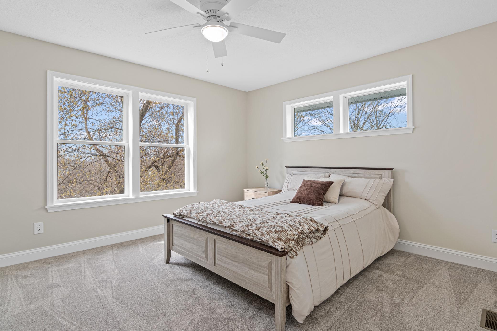 Owners Suite with view of Lake through trees