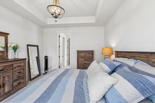 Primary bedroom with private walk-in closet and en suite bathroom