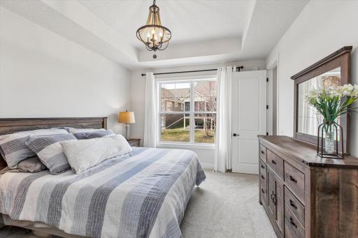 Bright primary bedroom right off living room
