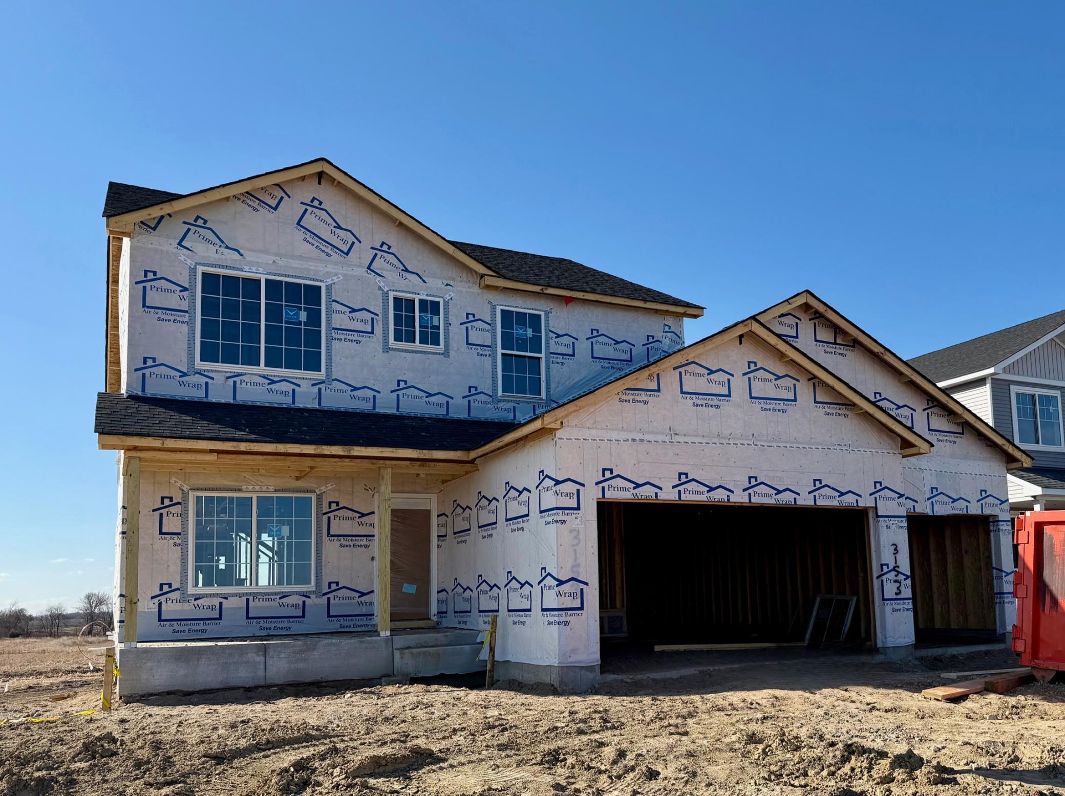 3153 Jandura Ave NE- Photo of actual home under construction offering an estimated June move-in! Siding & stone accents will be installed soon. Sod, Irrigation System, and Front Plantings included.