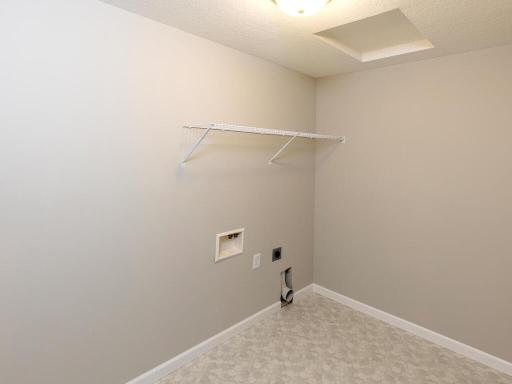 PHOTO OF A DIFFERENT HOME WITH SIMILAR PLAN. FINISHES MAY VARY. Spacious Upper Floor Laundry Room convenient to all the Bedrooms.