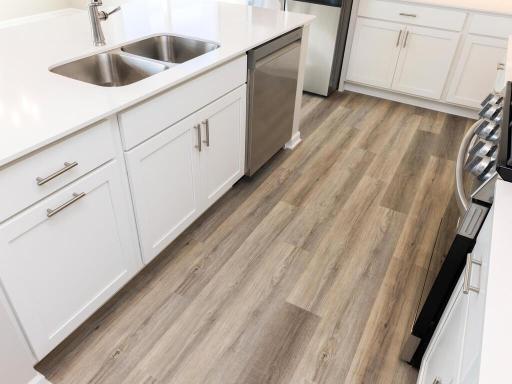 PHOTO OF A DIFFERENT HOME WITH SIMILAR PLAN. FINISHES MAY VARY. Spacious Kitchen Center Island.
