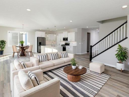 VIRTUALLY STAGED PHOTO OF A DIFFERENT HOME WITH SIMILAR PLAN. FINISHES MAY VARY. Great Room