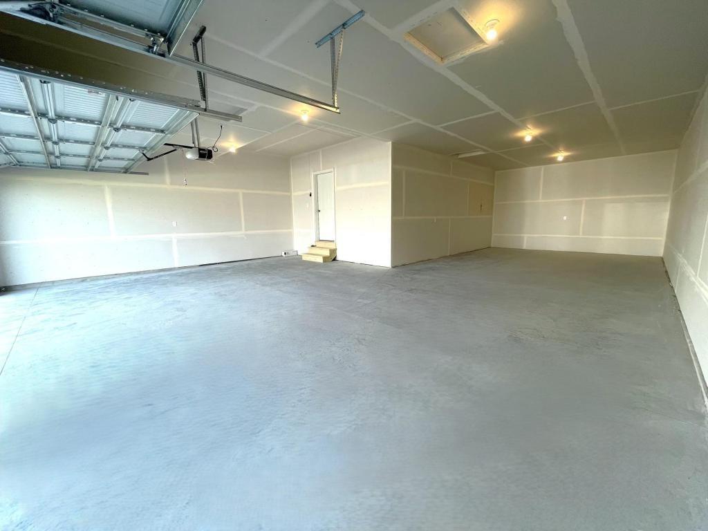 PHOTO OF A DIFFERENT HOME WITH SIMILAR PLAN. Spacious 4 Bay Garage (1,010 sq.ft.)!