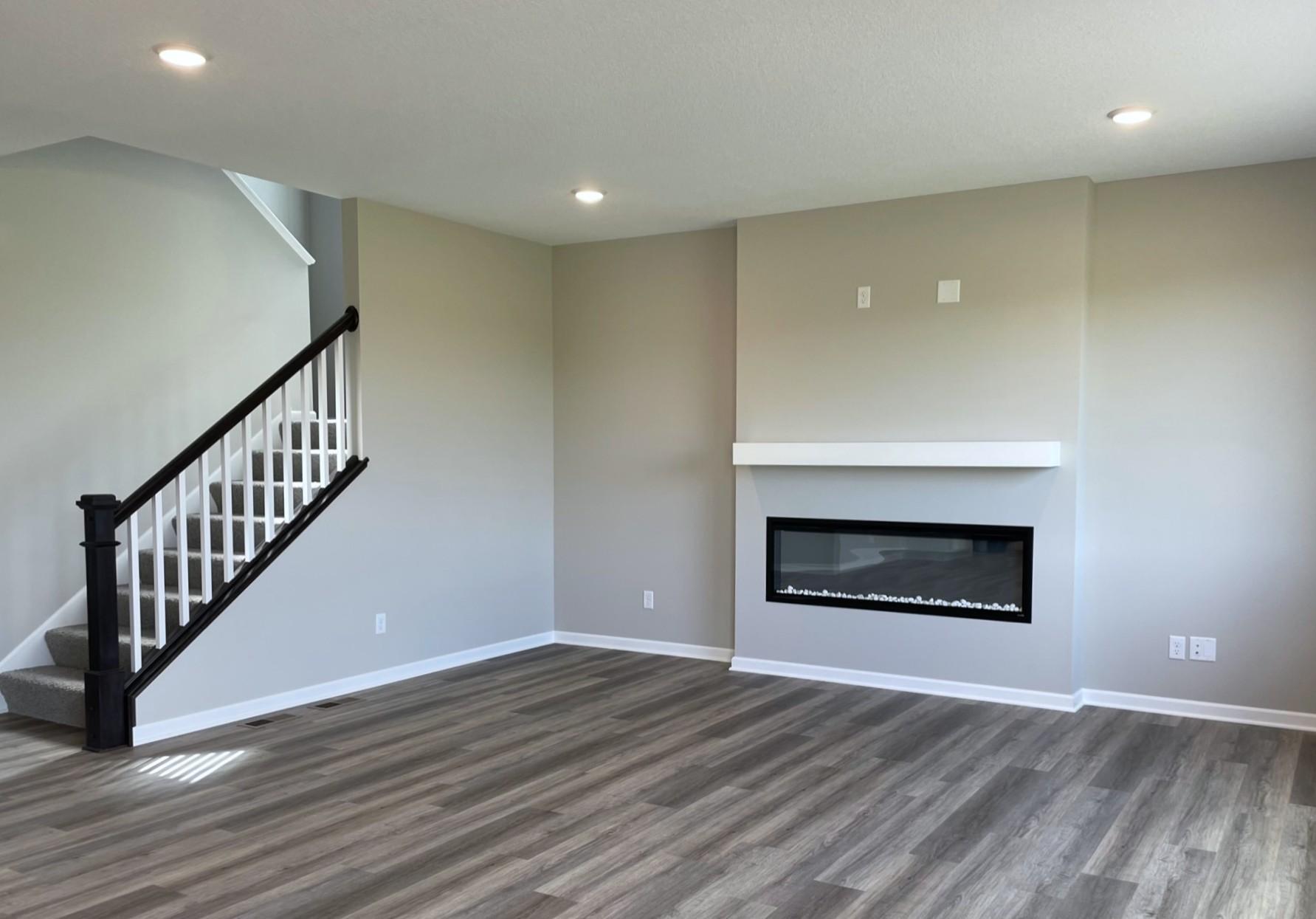 PHOTO OF A DIFFERENT HOME WITH SIMILAR PLAN. FINISHES MAY VARY. Great Room features a Fireplace with Mantel.