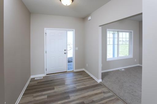 PHOTO OF A DIFFERENT HOME WITH SIMILAR PLAN. FINISHES MAY VARY. Foyer