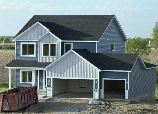 9674 32nd St NE- Home is currently under construction & will be ready for move-in on 6/30/26! Highlights include a 4 BAY GARAGE located on WALKOUT HOMESITE! Garage Doors will be installed soon. Sod, Irrigation System, & Front Plantings included.
