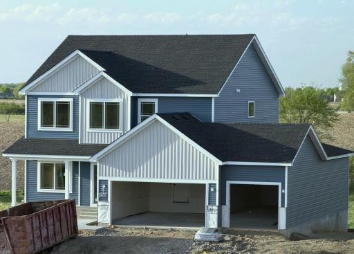 9674 32nd St NE- Home is currently under construction & will be ready for move-in on 6/30/26! Highlights include a 4 BAY GARAGE located on WALKOUT HOMESITE! Sod, Irrigation System, & Front Plantings included. Garage Doors will be installed soon.
