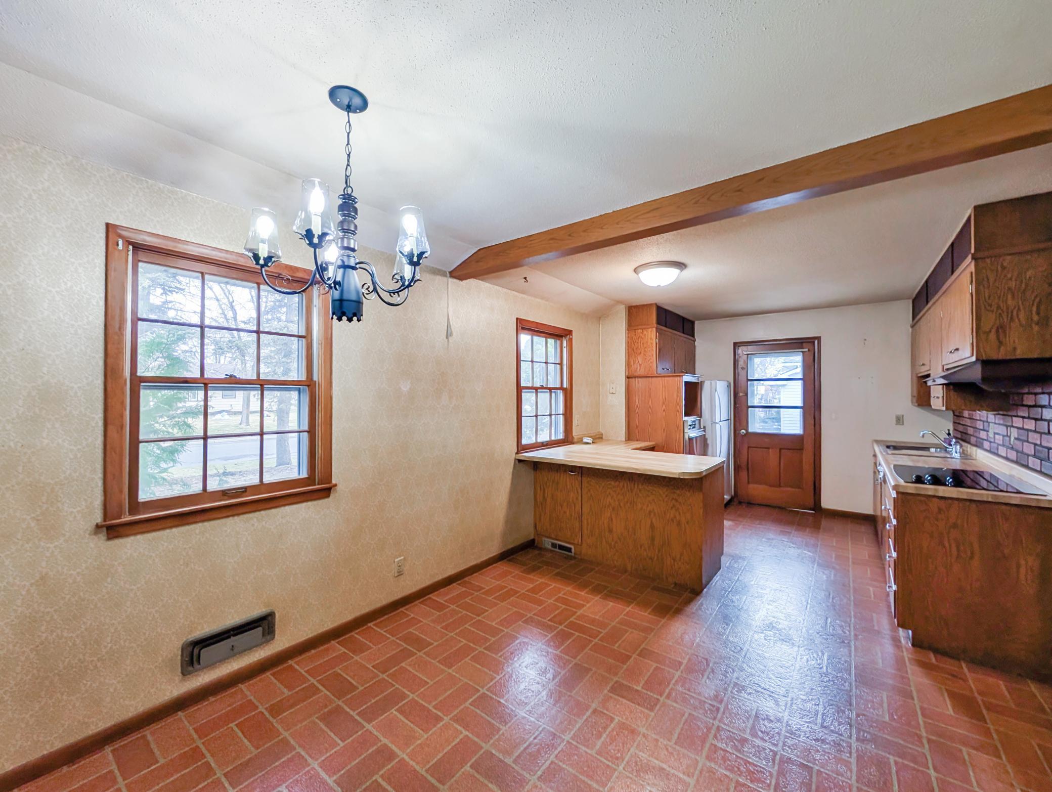 Dining area with light fixture and window!