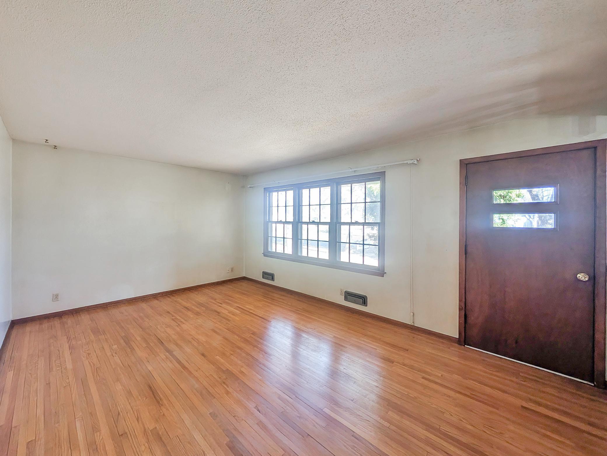 This living room is ready for your personal touch to make it your home!