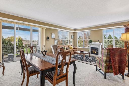 Large entertaining space with plenty of room for a formal dining area and place to watch TV. check out the electric fireplace!