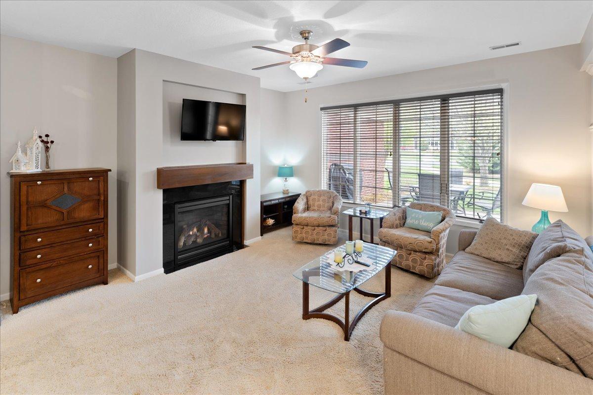 Cozy gas fireplace: a natural gathering spot during Minnesota seasons.