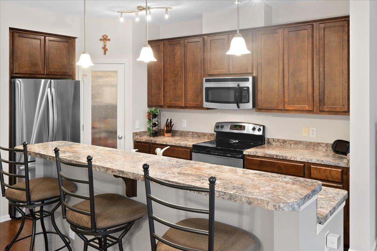 Functional kitchen with stainless steel appliances and abundant cabinetry.