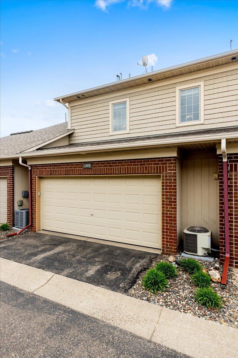 Tucked Into a Quiet Corner: Private Entry, Attached Garage, and Low Maintenance Living