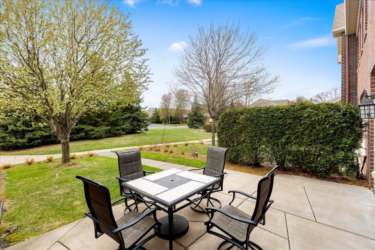 Outdoor Dining and Grilling Space Designed for Easy Everyday Living in The Lakes