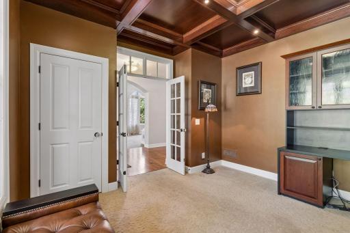 Main level office with french doors and transom window