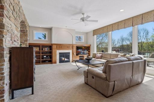 Great room with gas fireplace, built-ins and transom windows