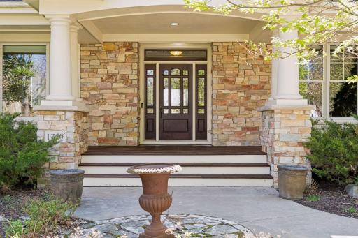 Real exterior stone and wrap around porch