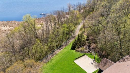 Walking trail behind home leads to private dock on Lake Lucy