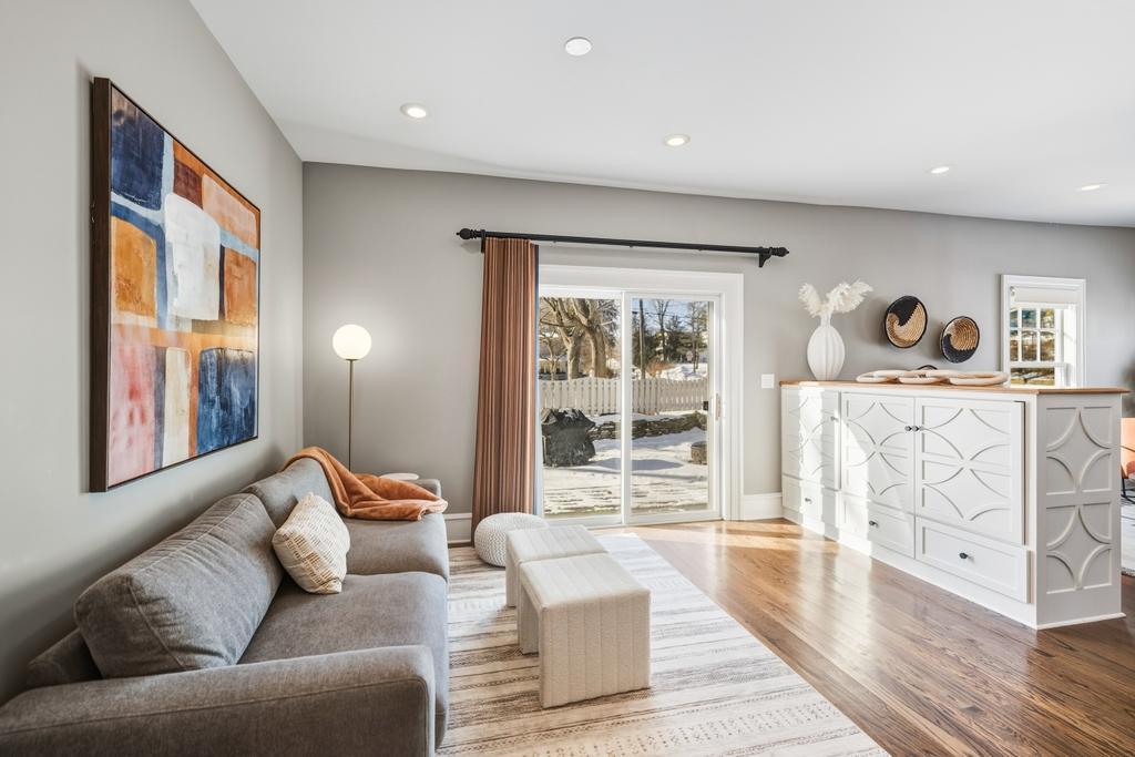 A patio door draws in natural light and creates a seamless connection to the deck beyond, offering just enough of a glimpse of the outdoors to remind you that lake days and sunset cruises are never far away.