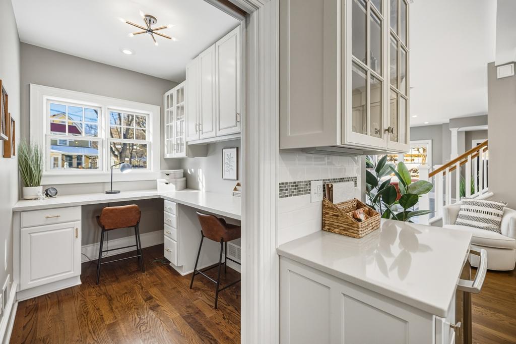 Tucked just off the kitchen, this versatile office works perfectly as a quiet workspace.